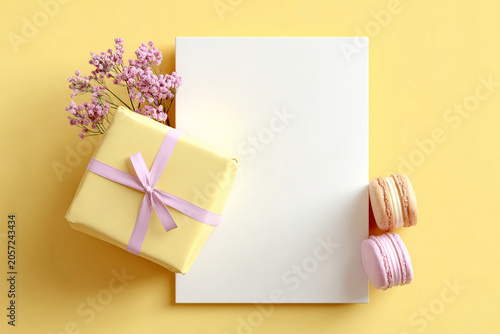 Blank Greeting Card Mockup with Gift Box and Flowers on Yellow Background