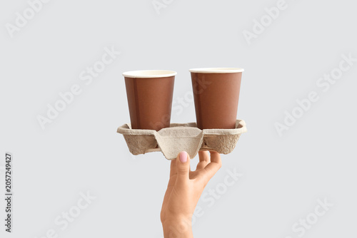 Female hand with brown take...
