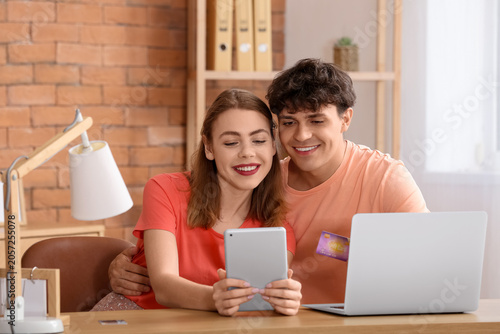 Young couple with tablet co...