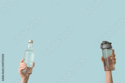 Female hands with bottles o...