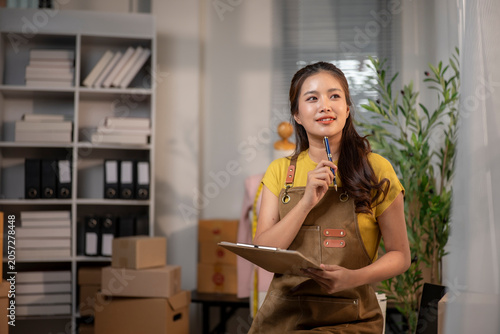 Asian businesswoman thinking about small business strategy