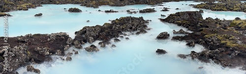 Panoramic view of the Blue Lagoon geothermal pools with milky blue water and lava rocks, Reykjanes Peninsula, Iceland