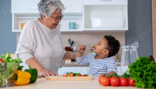 Grandmother teaching grandchild traditional recipe in kitchen