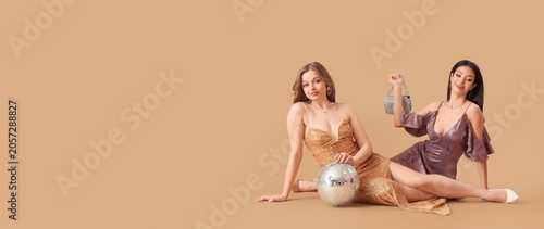 Two young women in sequin p...