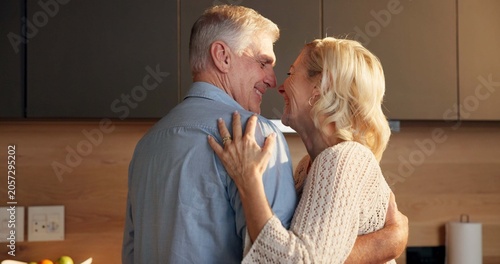 Fotografía Love, hug and old couple in home for support, comfort or bonding together in kitchen