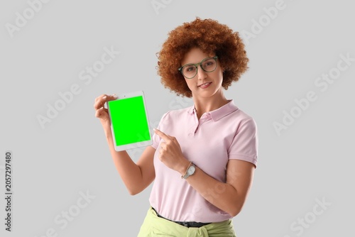Young woman with curly hair...
