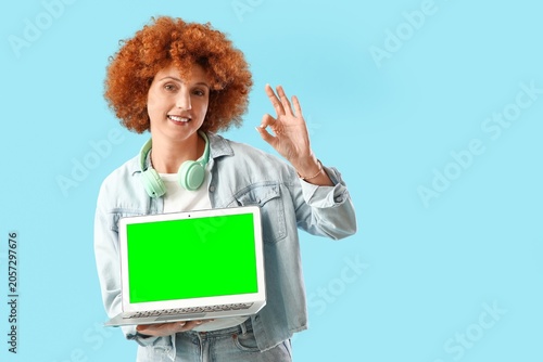 Smiling woman with red curl...