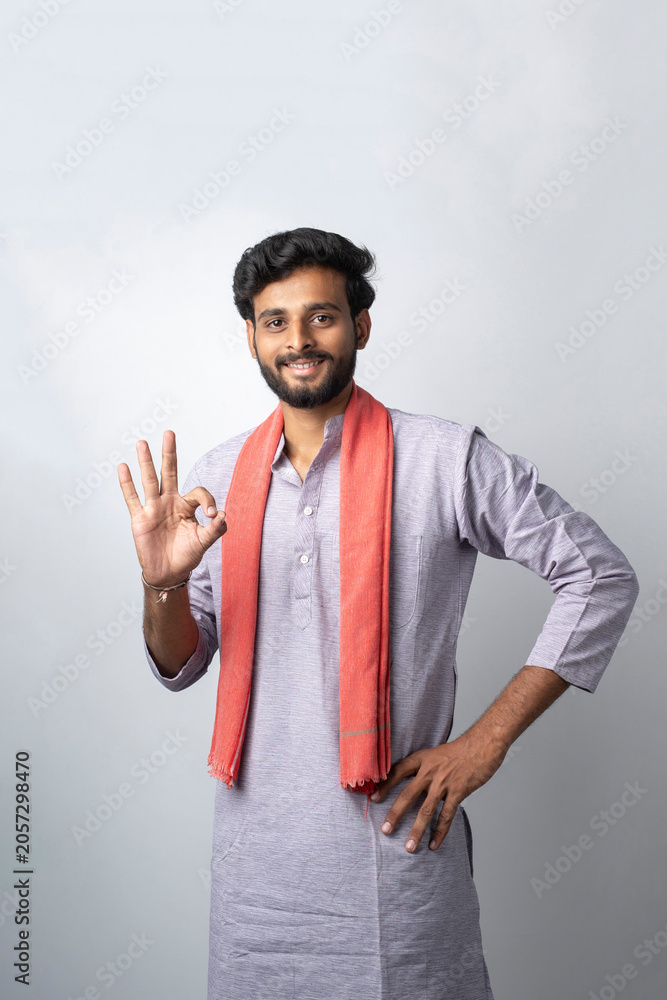 Fototapeta premium Happy indian farmer showing on white background