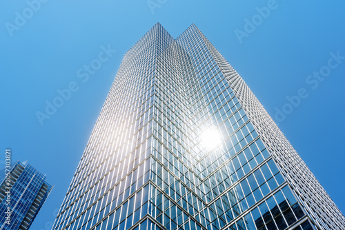 Photography Modern glass skyscrapers reflecting sunlight in downtown business district