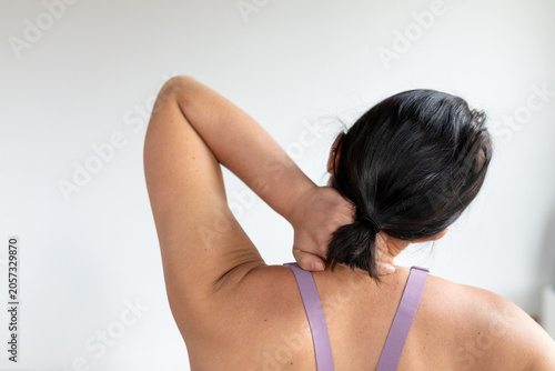 Canvas Print Woman relieving neck pain naturally.