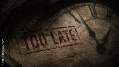 Old paper stamped with too late and clock shadow evokes consequences and accountability in dramatic vintage concept about deadline failure and urgent regret