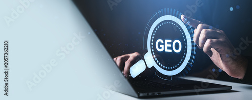 Digital geo search interface with hand interacting over laptop in modern business concept background showing technology focus and location insight.