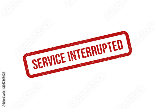 Red rubber stamp with the text service interrupted on a tilted label
