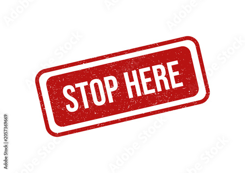 Red rubber stamp with the text stop here in a grunge style design