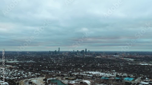Aerial Snow in Austin Texas Tilt Down Reveal Mueller Lake Downtown Skyline