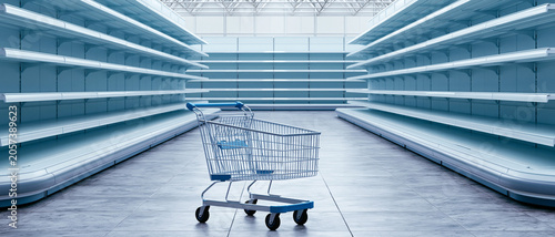 An empty shopping cart sits in the middle of a brightly lit, modern supermarket aisle with empty shelves on both sides. The scene suggests a lack of products.