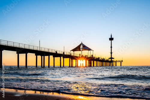 Adelaide coastal sunset at Brighton Beach Jetty with people silhouettes