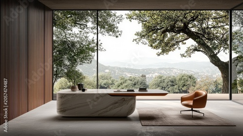 Contemporary office space features a large marble desk and leather chair overlooking a lush natural landscape