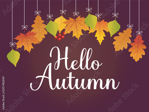 Hello autumn text with hanging colorful leaves and berries on dark background.