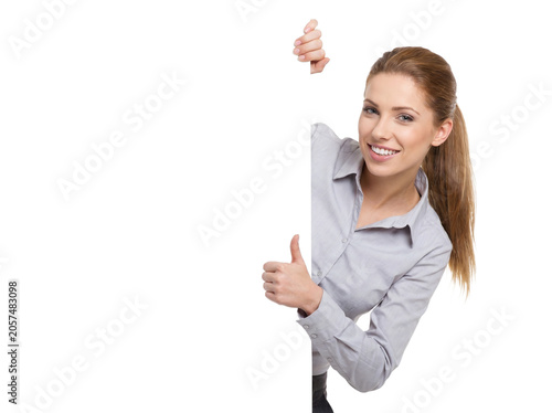 Smiling business woman holding blank white board with thumbs up, professional female office worker with empty placard, corporate advertising banner
