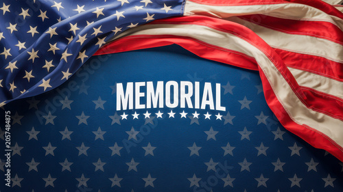Large american flag draped gracefully over a deep blue textured background with white memorial text and subtle star pattern overlay