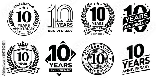 Set of 10 years anniversary logo emblems, vector illustration collection of ten year anniversary badges with laurel wreaths, crowns, ribbons and typography