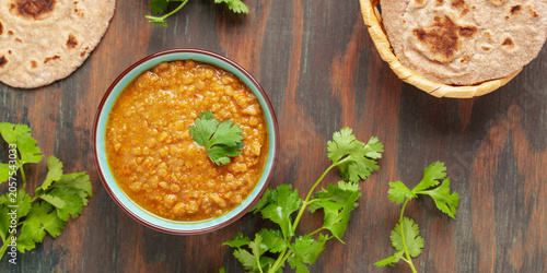Indian dal food (Masoor Dal or Dal Tadka Curry) and homemade Flatbread Chapati. Traditional Indian soup lentils. Indian Top view