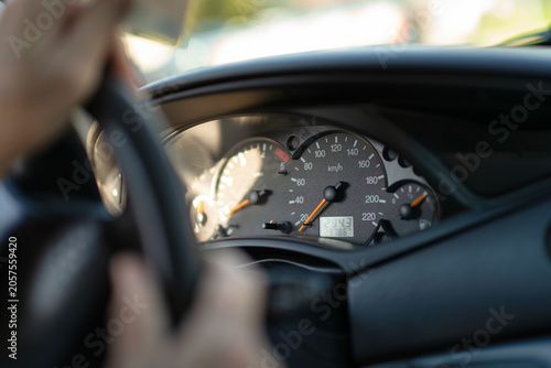 Canvas Print Driver holding steering wheel with dashboard display