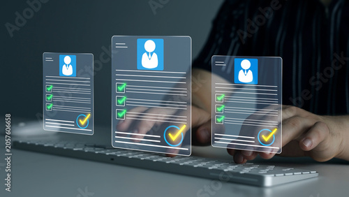 Photos Digital documents with check marks verified staff records and online HR management