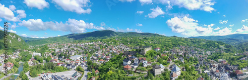 Aerial drone panorama of historical Jajce town and medieval fort at top of the hill