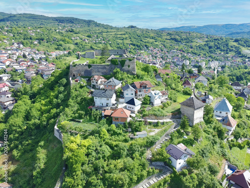 Aerial drone shot of historical Jajce town and medieval fort at top of the hill