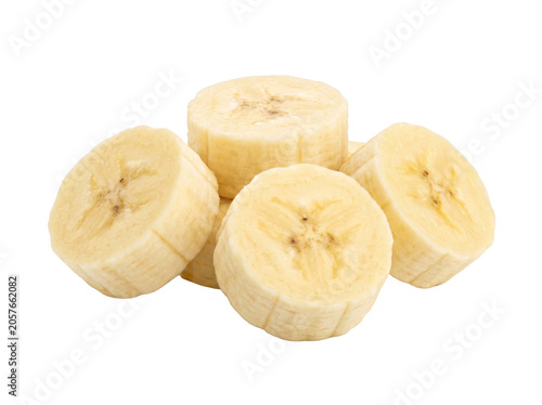 Bild auf Leinwand Several ripe banana slices arranged in a pile on a white background