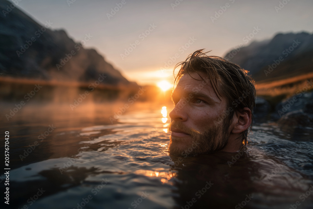 Fototapeta premium Clean and honest view of man in mountain hot spring during sunrise