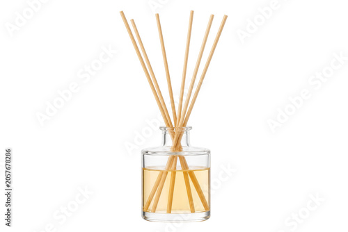 Fotografía Elegant glass reed diffuser with natural wooden sticks and amber liquid