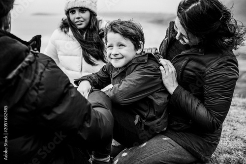 Vászonkép Family enjoying a windy day outdoors together
