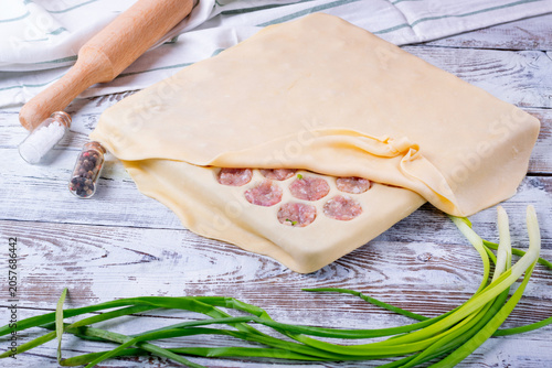 Φωτογραφία Making homemade dumplings using a special pelmeni maker (pelmennitsa)
