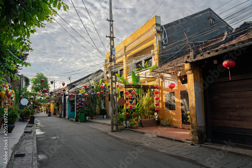 Traditional architecture and lantern decorations along a peaceful street in Hoi An Ancient Town.