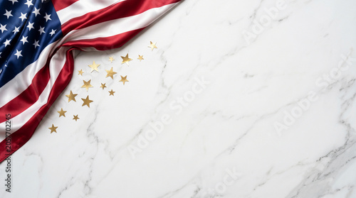 American flag with gold stars on white marble background for independence day celebration
