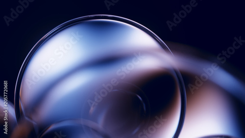 Glass lens closeup with soft blue premium reflective glow.