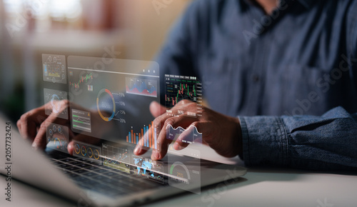 Business financial stock market concept. Businessman analyzing financial data stock market. Business finance stock bar chart Hologram. Business success and growth, economic growth graph.