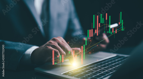 Business financial stock market concept. Businessman analyzing financial data stock market. Business finance stock bar chart Hologram. Business success and growth, economic growth graph.