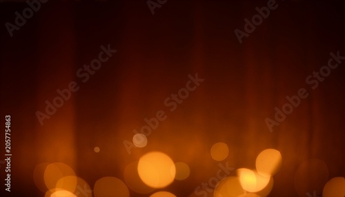 Warm golden bokeh lights on dark brown gradient background