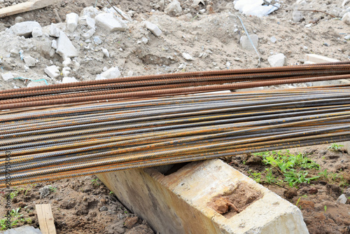 Building construction. A stack of metal reinforcement bars at the construction site.