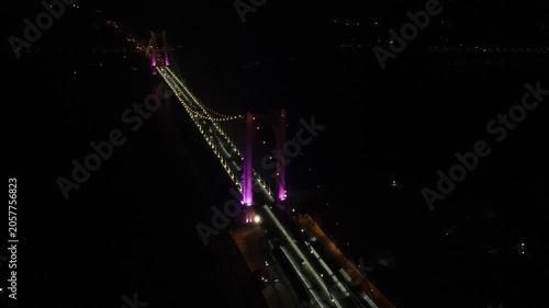 Aerial Night View of Illuminated Suspension Bridge with Traffic