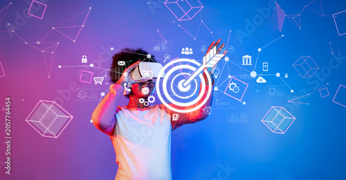 Quadro su tela A young professional explores virtual reality technology to enhance online marketing strategies and engage target audiences, emphasizing innovation and creativity