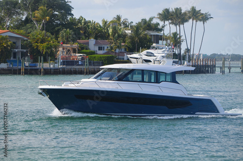 Blue and White Crossover Cabin Cruiser  off of Dilido Island,Miami Beach.