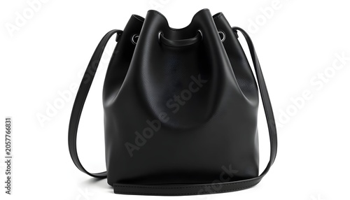 A black leather bag sits on a white surface in a studio setting.