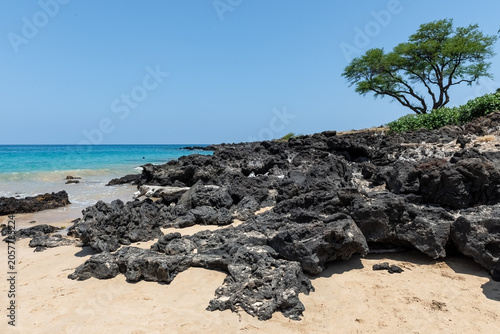 Hapuna Beach, the Big Island, Hawaii, USA - May 14th 2022: The volcanic rocks of Hapuna Beach on the Big Island, Hawaii.