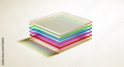 Stack of colorful transparent glass plates isolated on white background