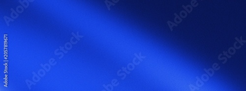 Abstract grain background with blue spectrum light leak on dark texture and noise with vibrant gradient colors. indigo film overlay.